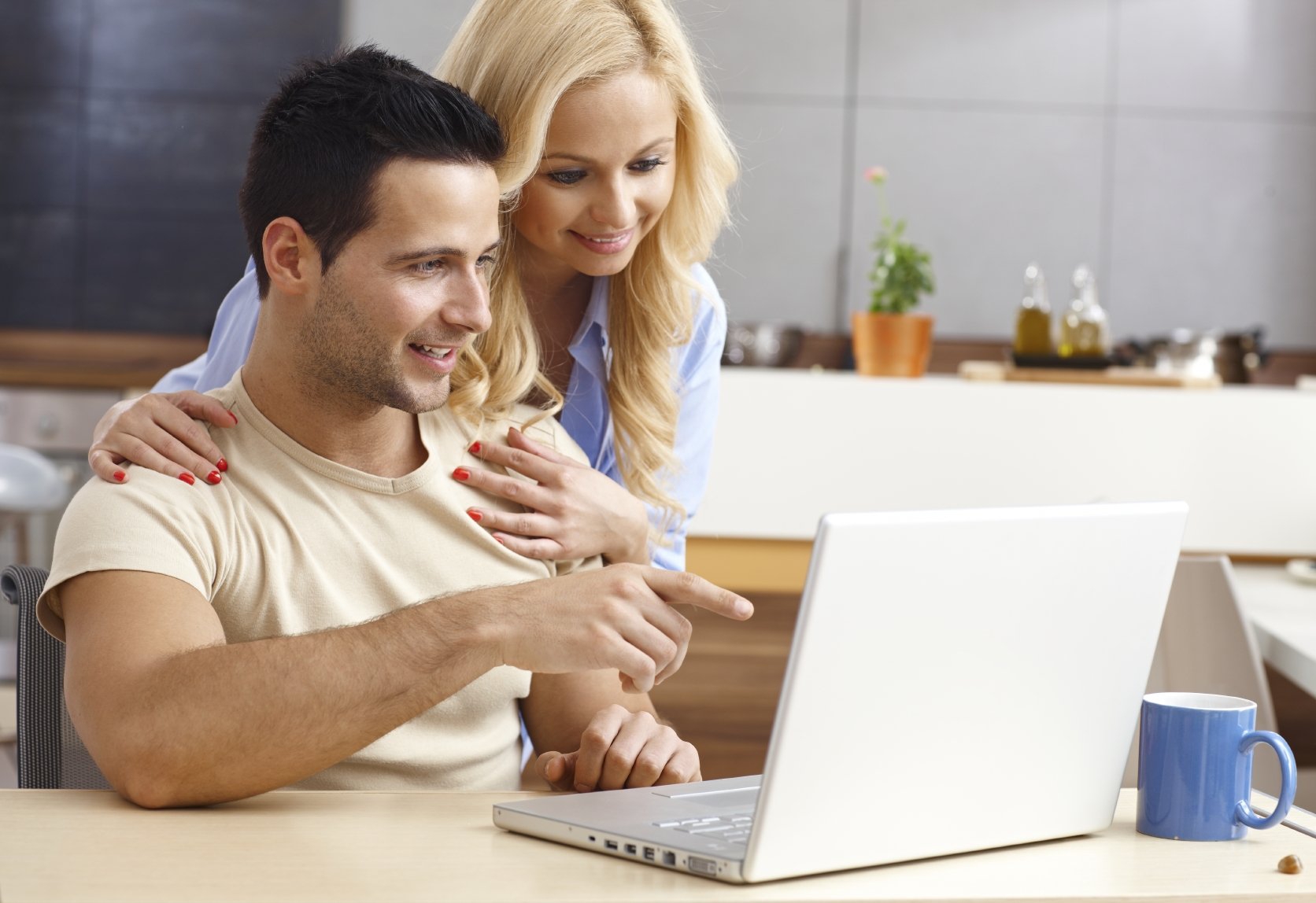 Man and woman looking at computer