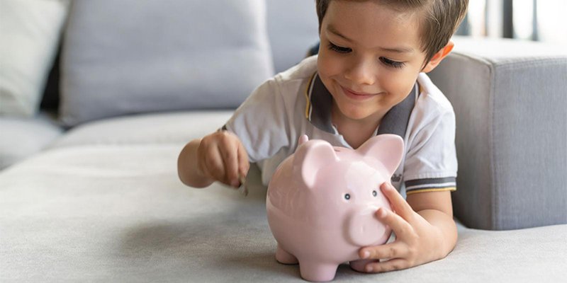 Baby with piggy bank