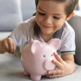 Baby with piggy bank