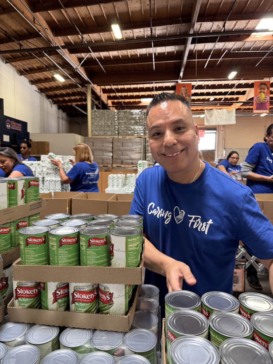 AFCU associate packing boxes with food