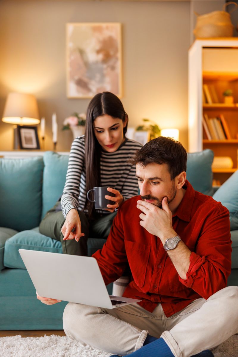 Woman making a secure transaction on her laptop with a credit card