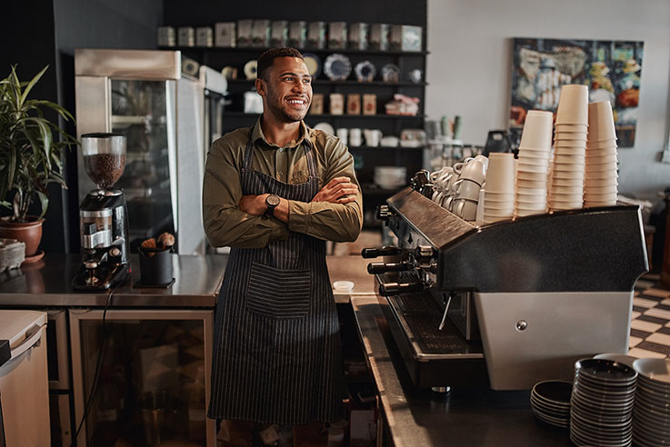 man smiling in coffee shop