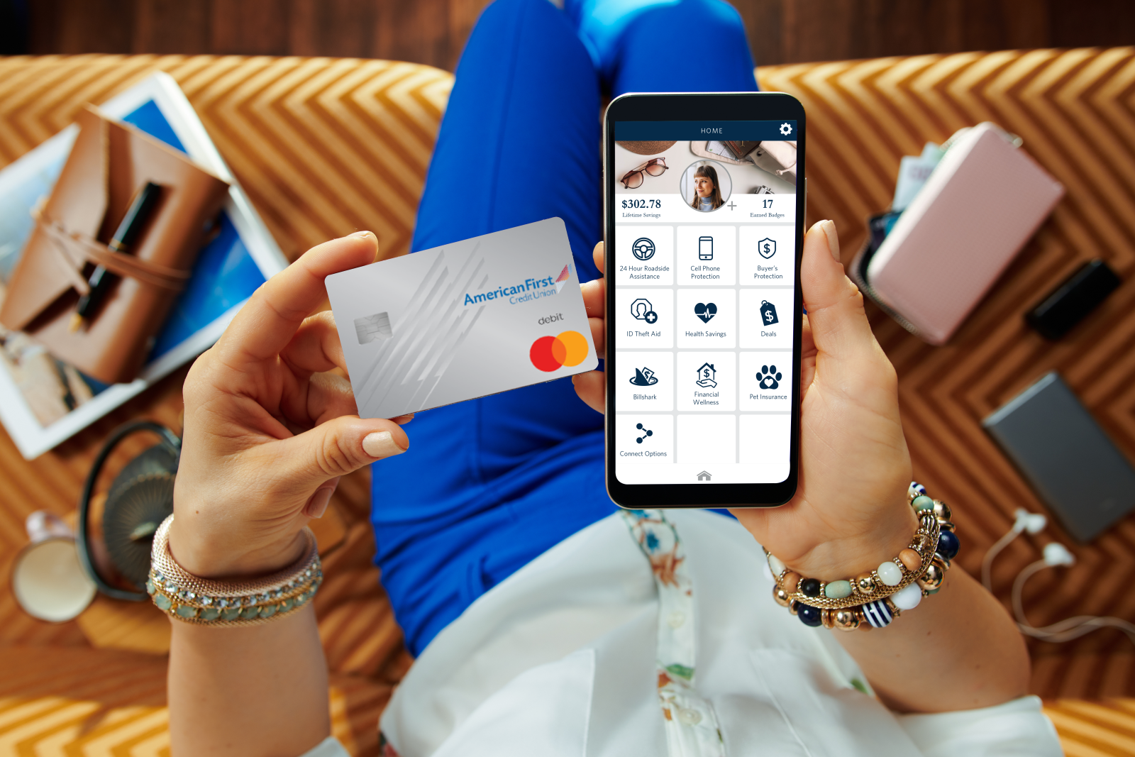 Man holding an AFCU Credit Card with Rewards