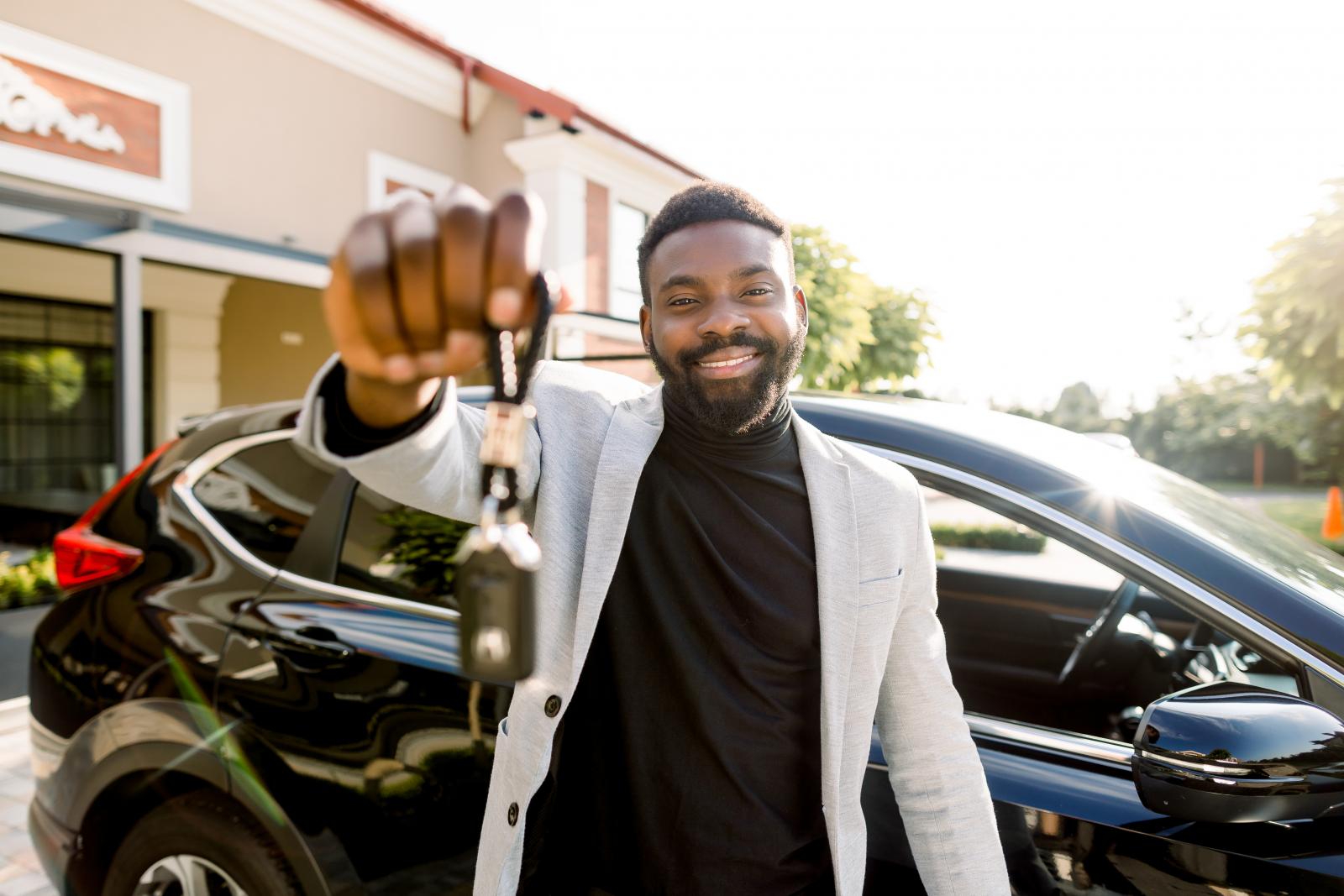 a man takes cash out of a checking account at an ATM